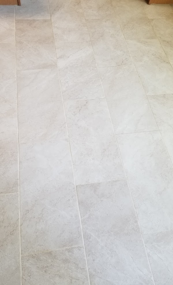 Same tile floor after cleaning, grout lines bright again